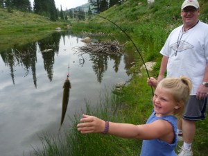 Kelly and Emmaus catch the first fish at Bloomington Lake.  