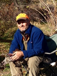 Tom Davis cleans an Idaho ruffed grouse.